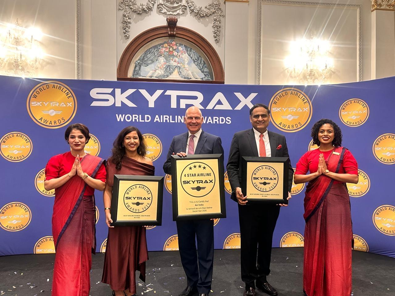 Campbell Wilson, CEO & MD, Rajesh Dogra, Chief Customer Experience Officer, and Anjali Birla, Head of Customer Experience and Loyalty, alongside members of the Air India cabin crew, receive Air India's awards at the 2026 Skytrax World Airline Awards in London.