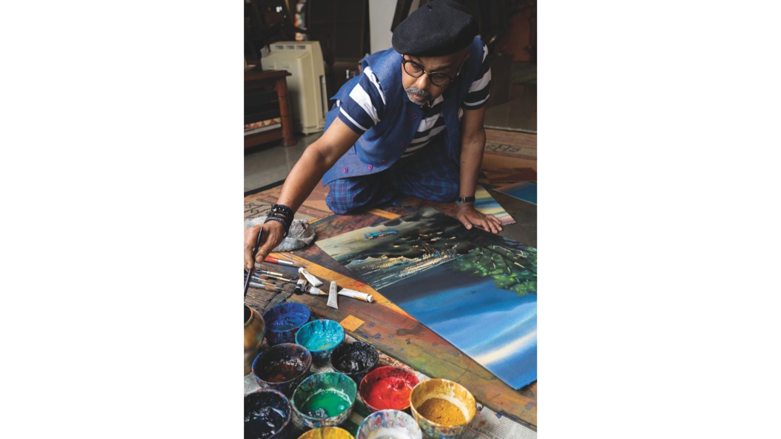 The artist deeply engrossed in his craft