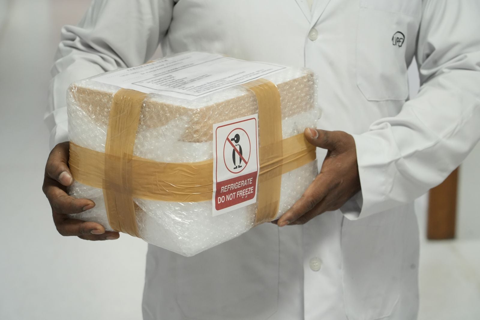 Insulated container carrying donated corneal tissue for transplant transport.