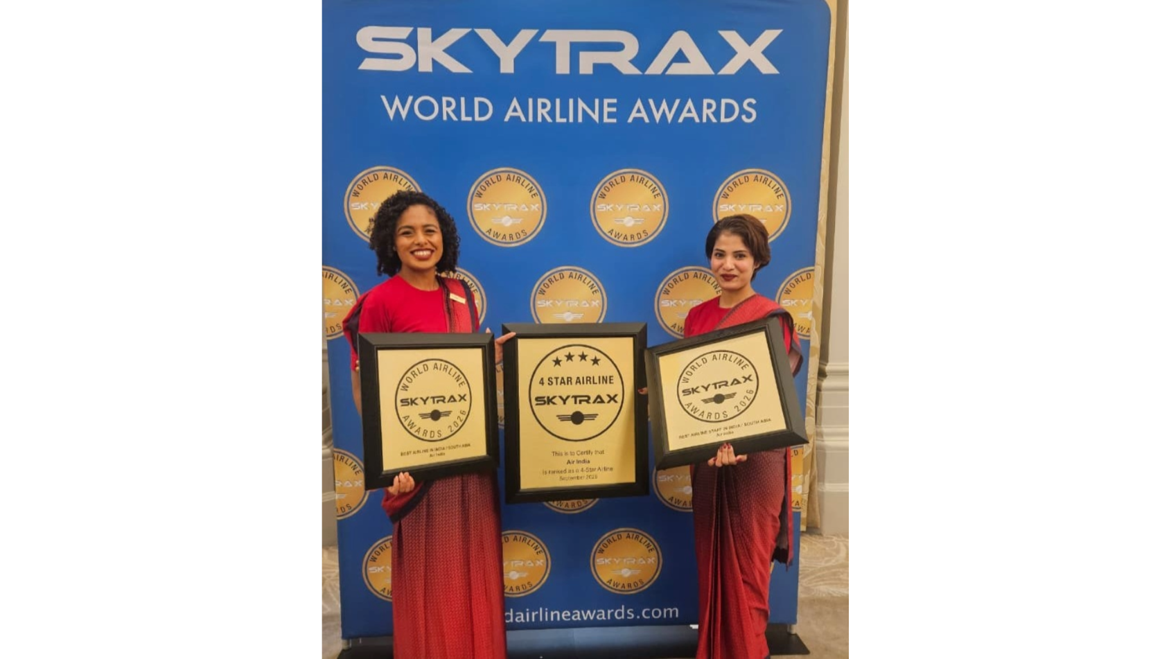 Members of the Air India cabin crew pose with the airline's awards at the 2026 Skytrax World Airline Awards in London. 