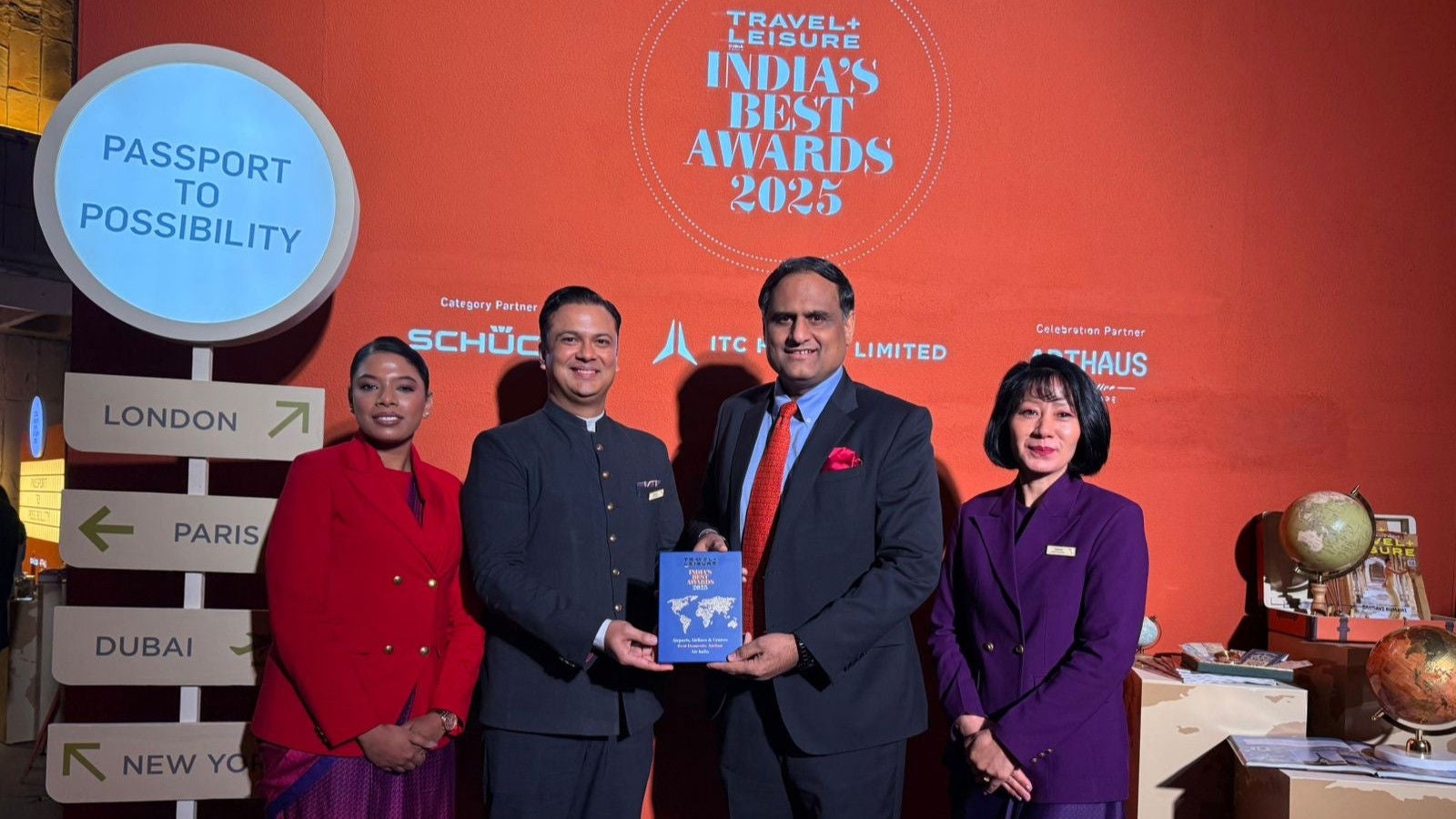 Rajesh Dogra, Chief Customer Experience Officer, Air India and the cabin crew pose at the event