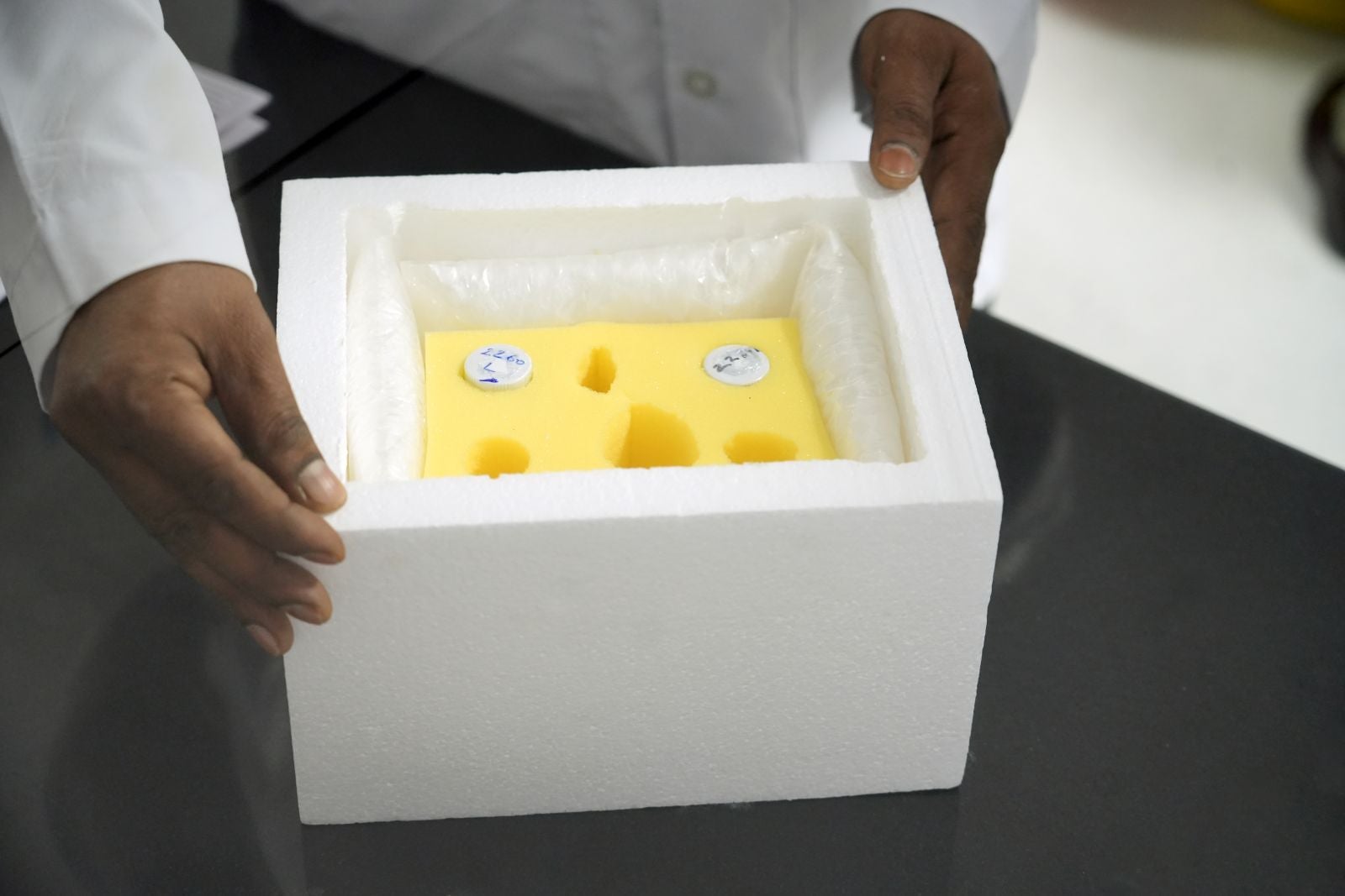 An insulated transport box containing preserved corneal tissue vials